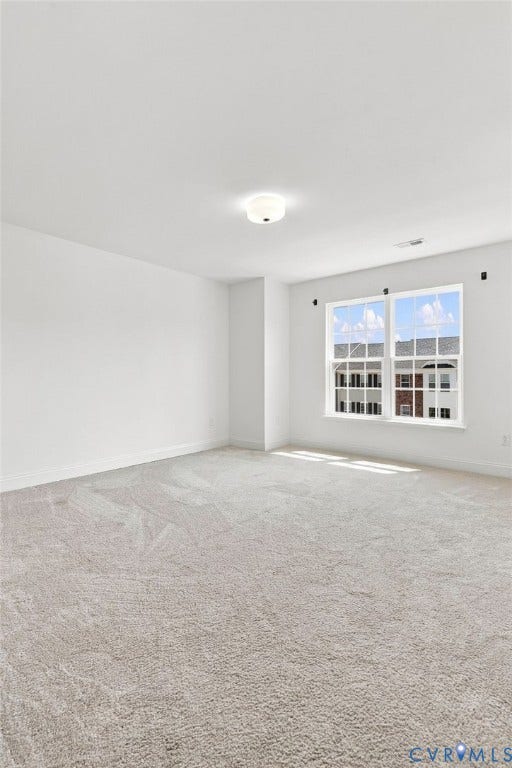 13820 Village View Drive, Midlothian, VA 23114 Spacious interior with neutral carpeting, white walls, and abundant natural light from a multi-pane window