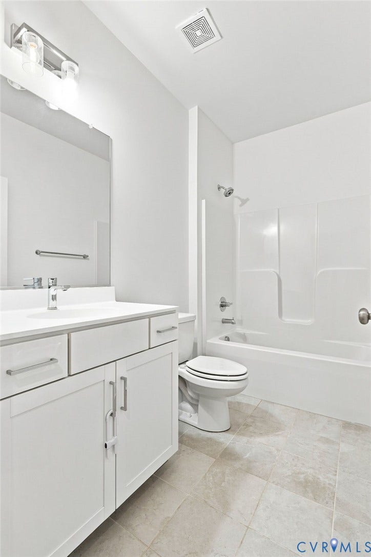 13820 Village View Drive, Midlothian, VA 23114 White vanity with a solid surface countertop, undermount sink, and brushed nickel fixtures