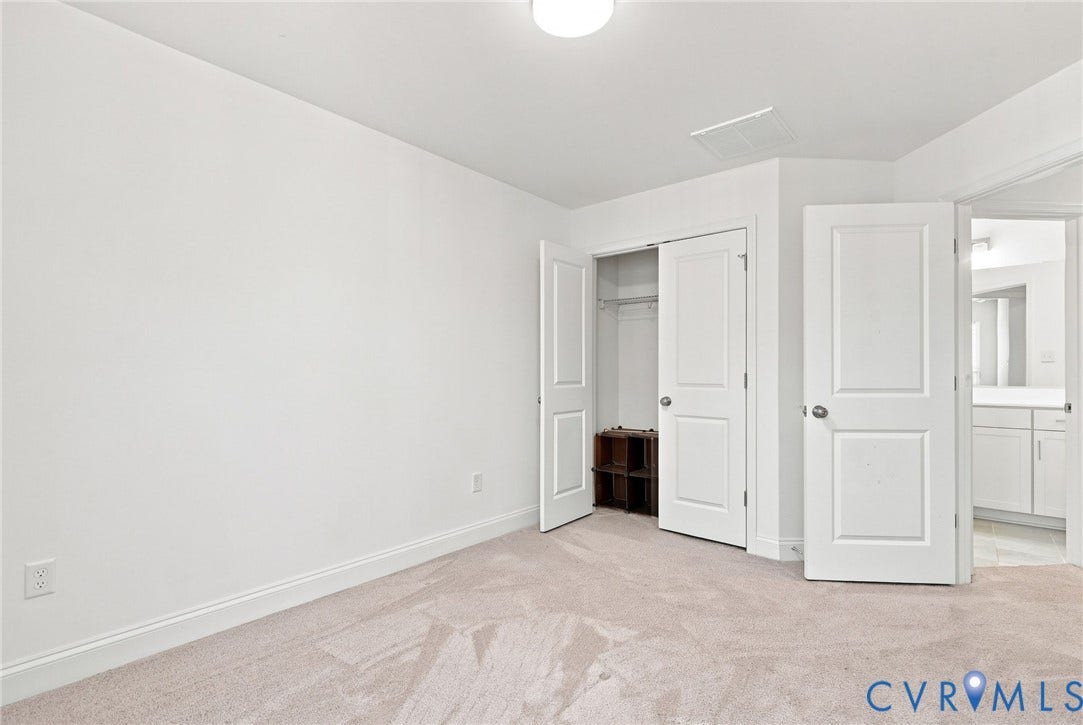 13820 Village View Drive, Midlothian, VA 23114 Neutral carpeting, white painted walls, white trim, white interior doors, and a closet with bifold doors