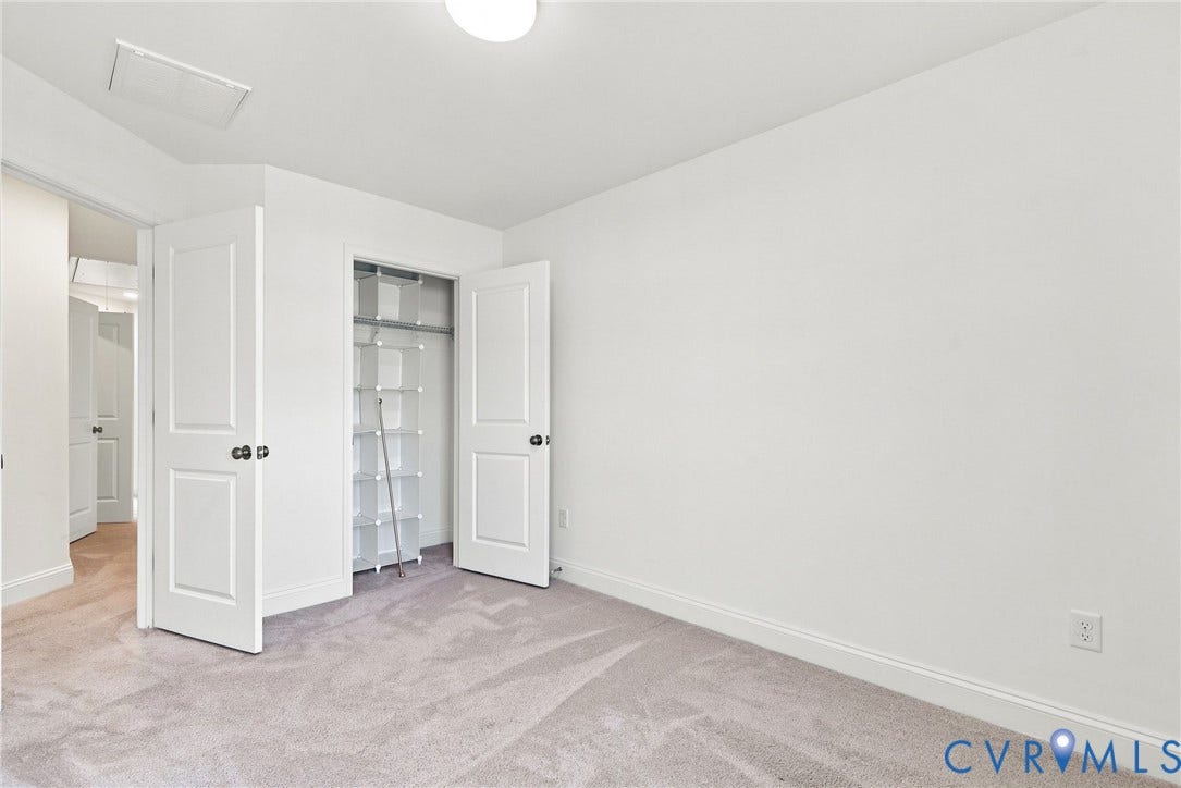 13820 Village View Drive, Midlothian, VA 23114 Plush carpet flooring, white walls, flush mount ceiling light, and a built-in closet with shelving