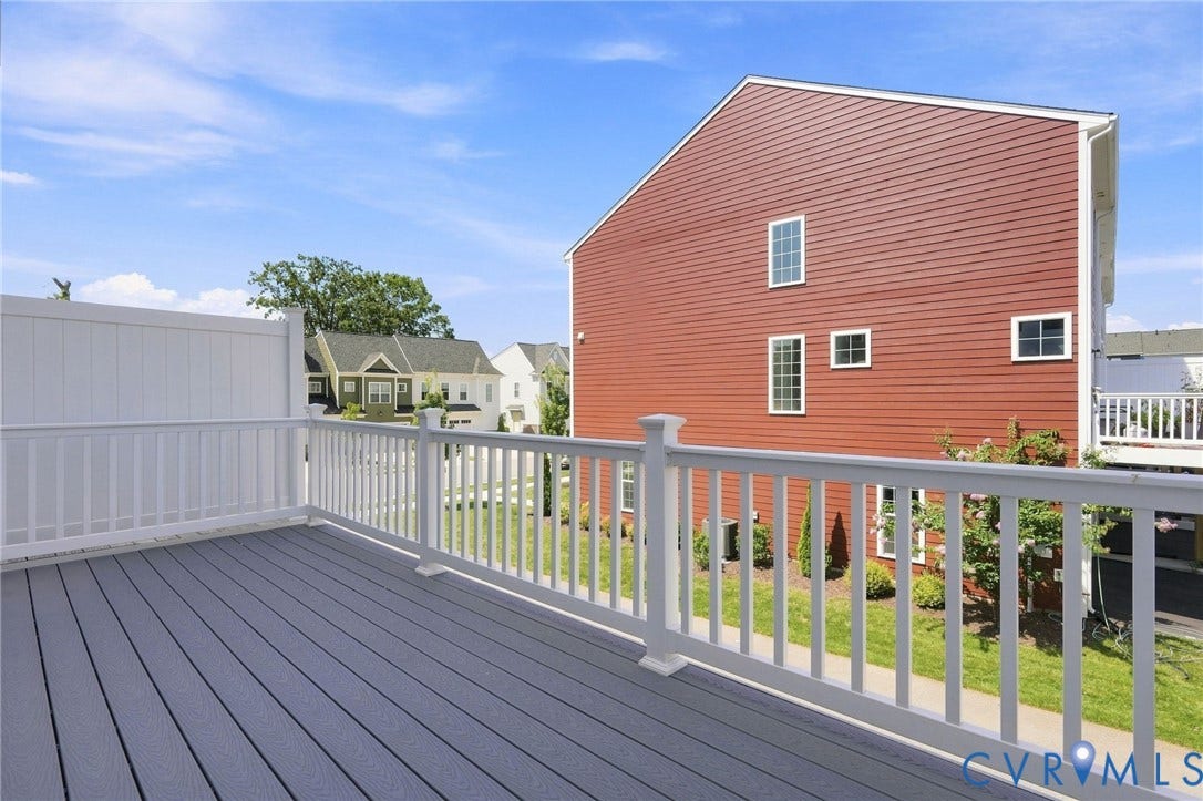 13820 Village View Drive, Midlothian, VA 23114 Deck with composite flooring, white railing, and white privacy fencing