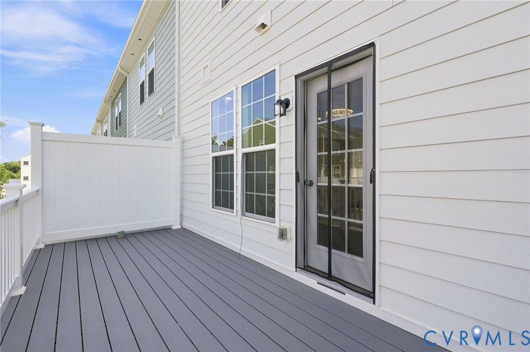 13820 Village View Drive, Midlothian, VA 23114 Exterior deck with gray composite decking, white privacy fencing, and white vinyl siding