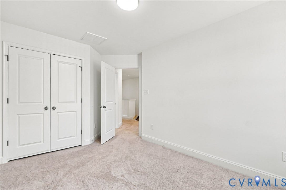 13820 Village View Drive, Midlothian, VA 23114 White walls, light-toned carpet, and a ceiling-mounted light fixture