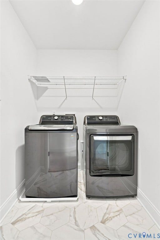13820 Village View Drive, Midlothian, VA 23114 Integrated laundry appliances with a wire shelving unit, overhead lighting, and hexagonal tile flooring