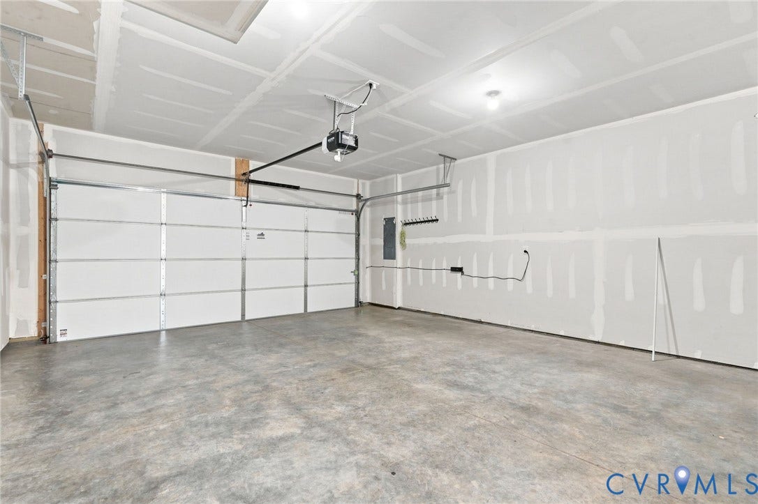 13820 Village View Drive, Midlothian, VA 23114 Concrete flooring, white overhead garage door, built-in garage door opener, overhead lighting