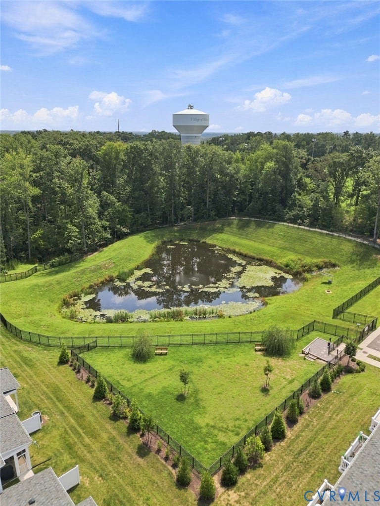 13820 Village View Drive, Midlothian, VA 23114 Expansive green space featuring a pond and fenced areas