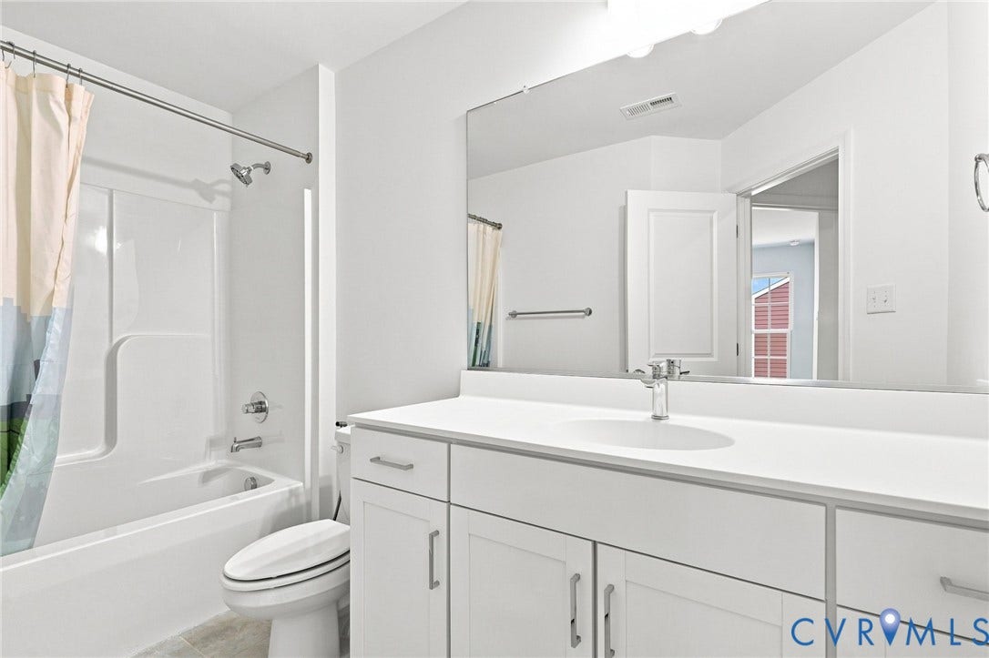 13820 Village View Drive, Midlothian, VA 23114 White vanity with integrated sink, chrome faucet, and expansive wall-mounted mirror