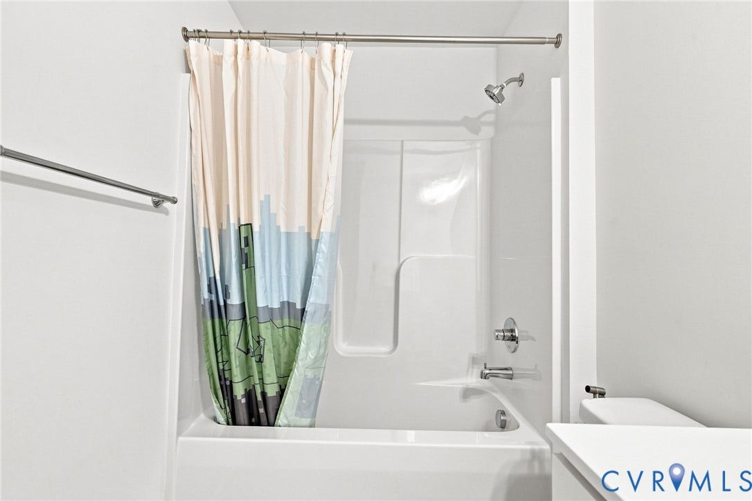 13820 Village View Drive, Midlothian, VA 23114 White bathtub with an integrated shower, chrome fixtures, and a shower rod