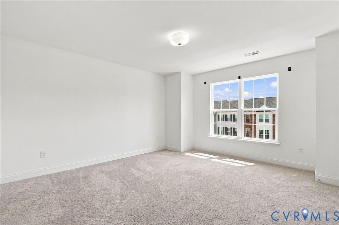 13820 Village View Drive, Midlothian, VA 23114 Carpeted flooring, white walls, white trim, recessed lighting, and a large multi-pane window