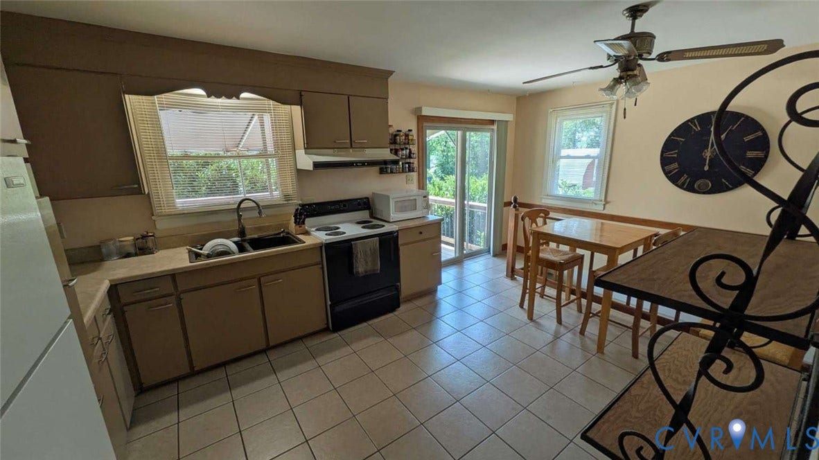 12853 Holly Lane, Manakin Sabot, VA 23103 Kitchen featuring a ceiling fan, tile flooring, sliding glass door, and a window above the sink