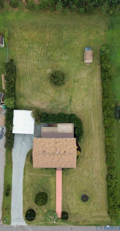 12853 Holly Lane, Manakin Sabot, VA 23103 Expansive property featuring a gabled roofline, substantial lawn areas, mature perimeter landscaping, and a detached outbuilding