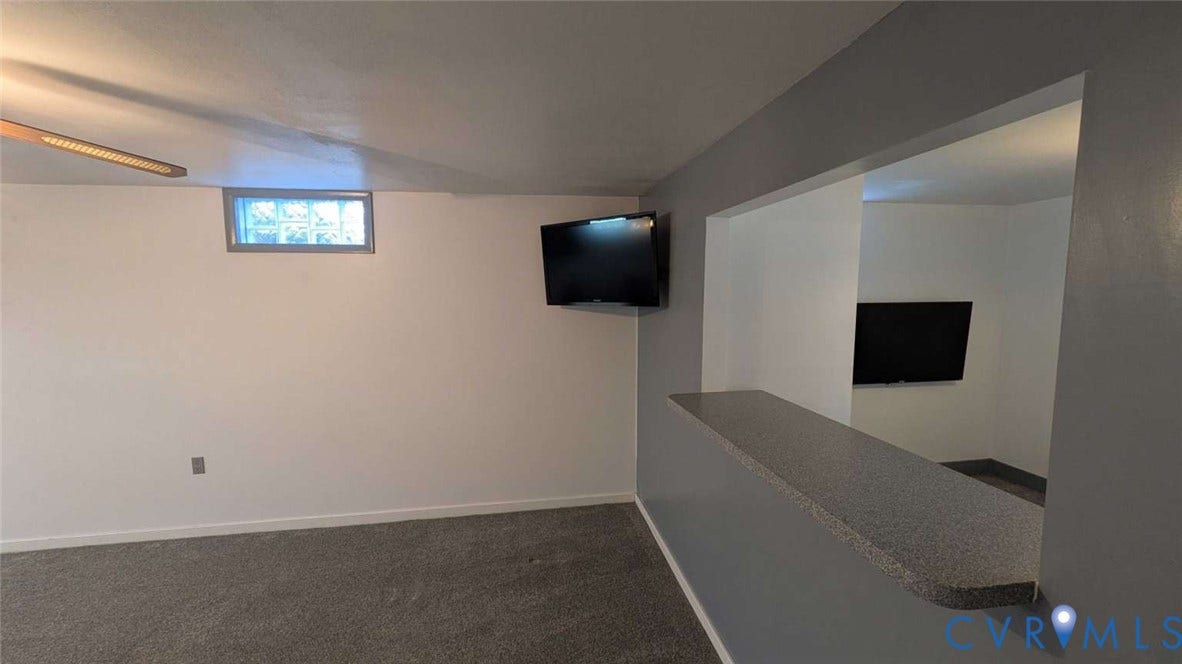 12853 Holly Lane, Manakin Sabot, VA 23103 Carpeted flooring, recessed window, and a pass-through counter with a stone-finish surface
