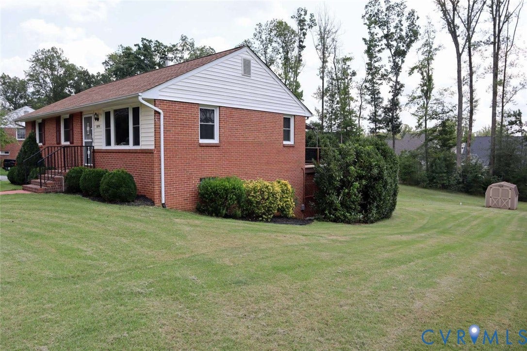 12853 Holly Lane, Manakin Sabot, VA 23103 Brick exterior with white siding accents and a contrasting roof