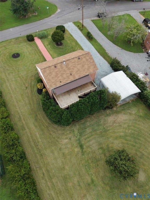 12853 Holly Lane, Manakin Sabot, VA 23103 Gable roof structure, a deck with an awning, a gravel driveway, and a detached carport