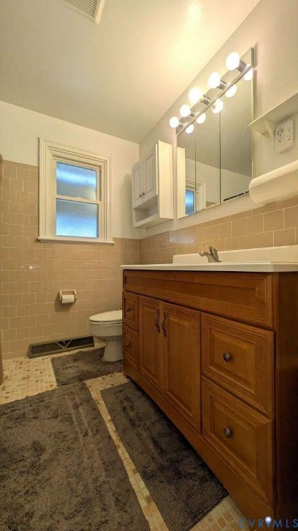 12853 Holly Lane, Manakin Sabot, VA 23103 Wood-finish vanity with an integrated sink and chrome faucet
