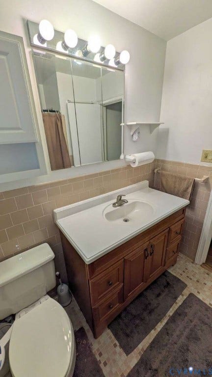 12853 Holly Lane, Manakin Sabot, VA 23103 Vanity with integrated sink, wood-finish cabinetry, and a mirrored medicine cabinet