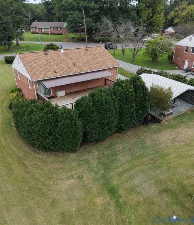 12853 Holly Lane, Manakin Sabot, VA 23103 Brick exterior, covered deck, shingle roof, detached metal carport, mature landscaping
