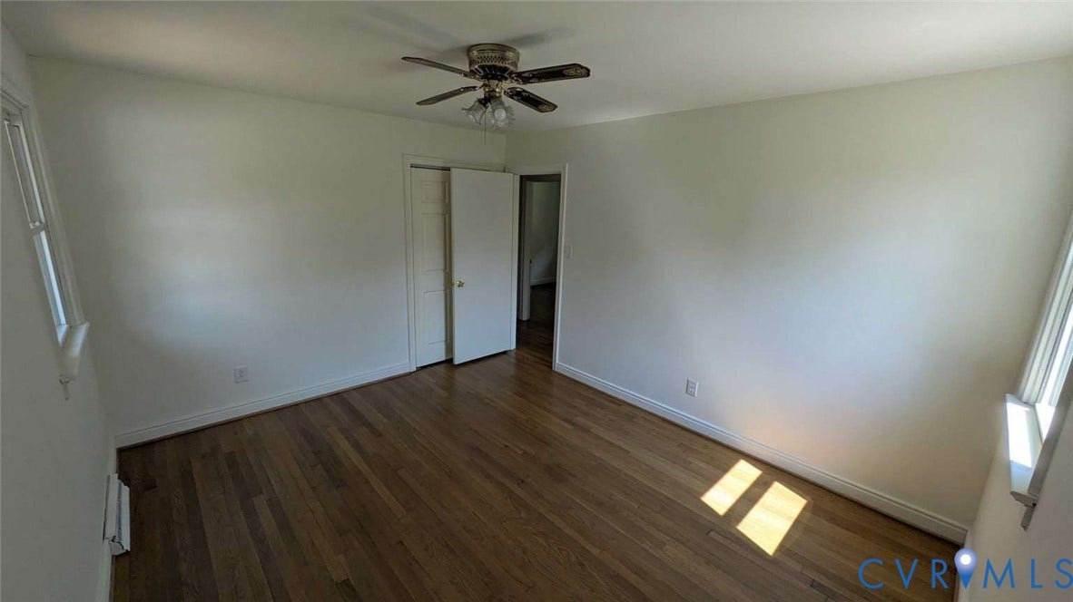 12853 Holly Lane, Manakin Sabot, VA 23103 Hardwood flooring, white walls, ceiling fan, bi-fold closet doors, and single-hung windows