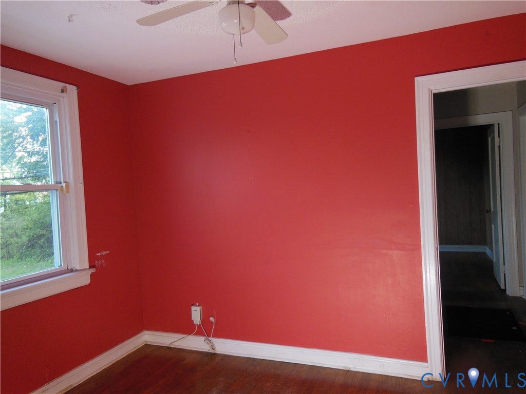 5307 Media Road, Richmond, VA 23225 Wood-finish flooring with white trim, a ceiling fan, and a single window