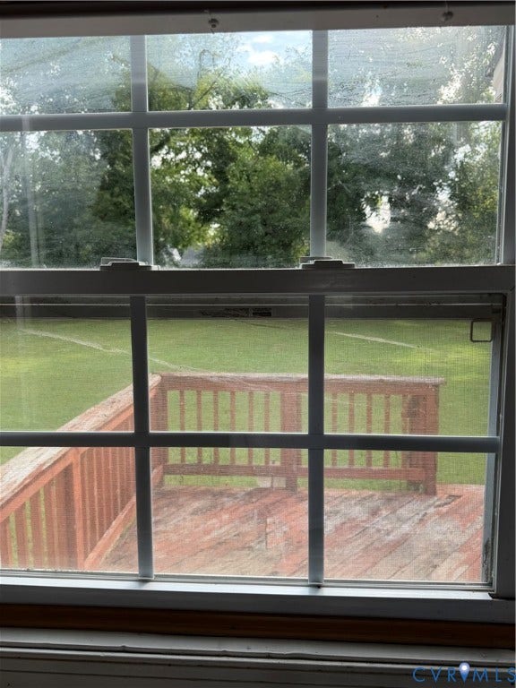 5101 Montpelier Street, Richmond, VA 23231 Window with muntins overlooking an outdoor wooden deck and green lawn