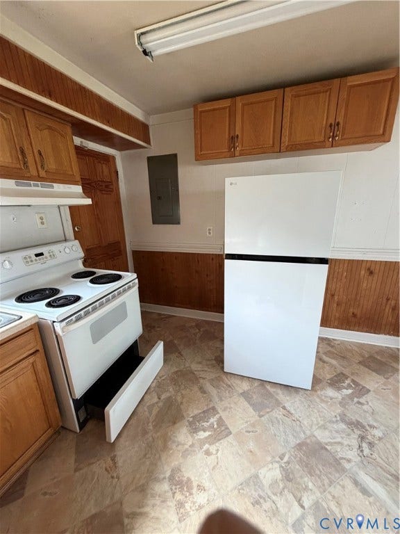 5101 Montpelier Street, Richmond, VA 23231 Wood-finish cabinetry, built-in range with an under-oven drawer, and patterned vinyl flooring