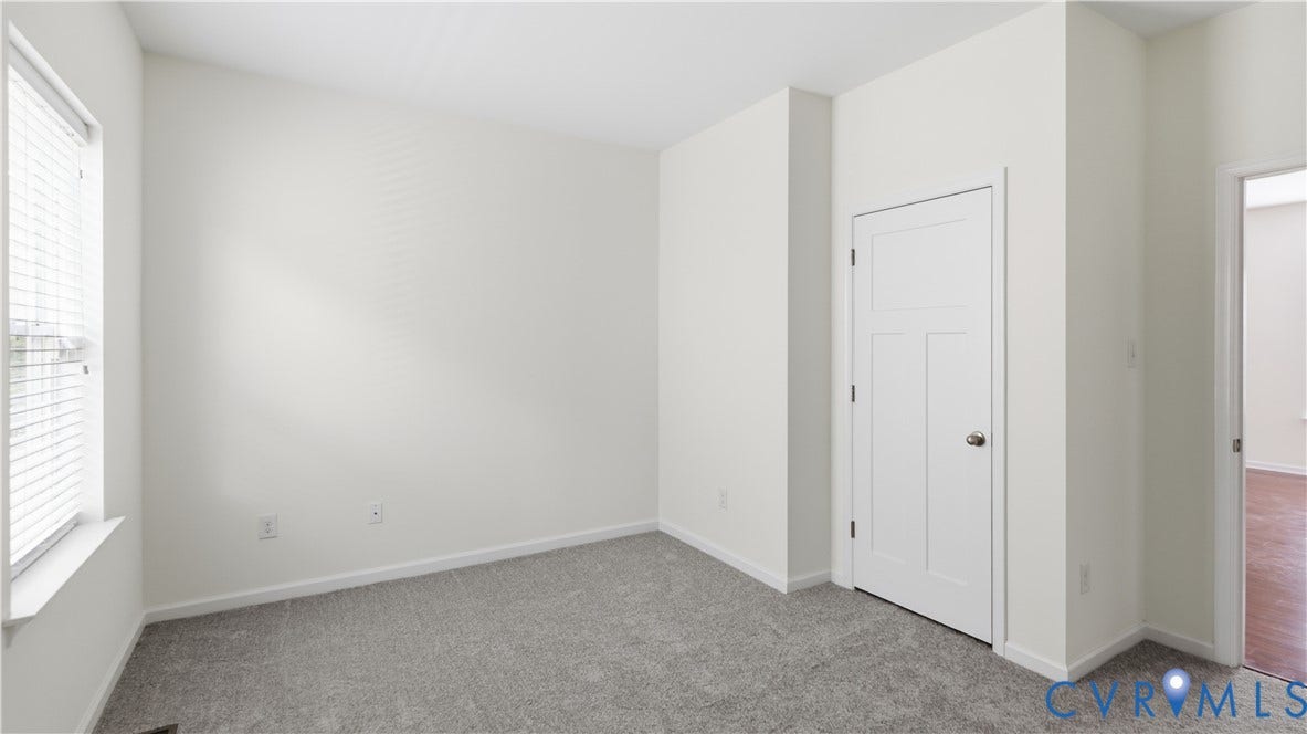 Light gray carpeting and white walls