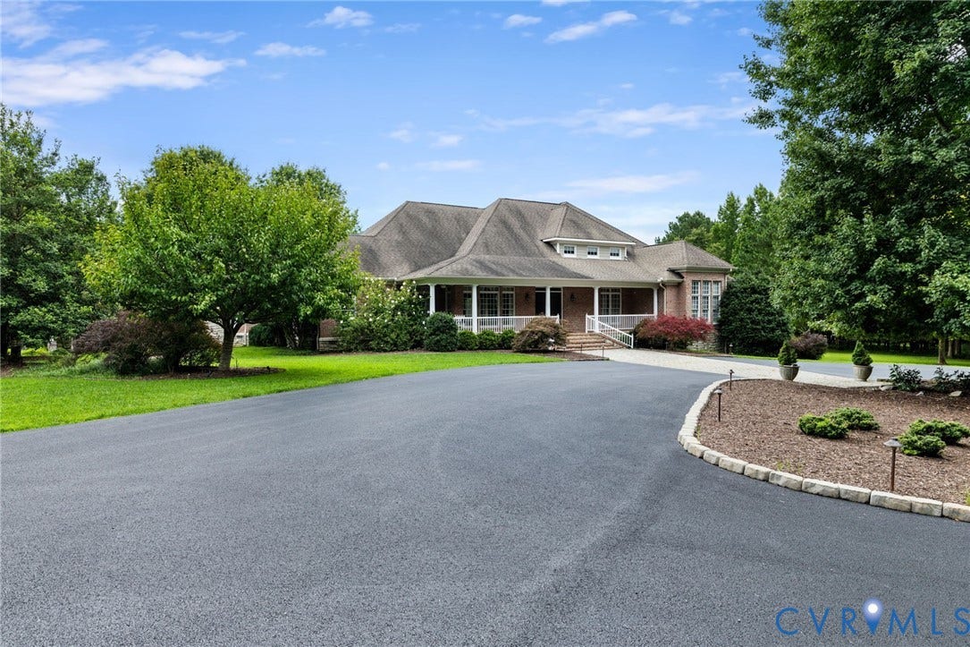 2365 Manakintown Ferry Road, Powhatan, VA 23113 Spacious asphalt driveway, mature trees, manicured lawn, brick exterior, and a broad covered porch