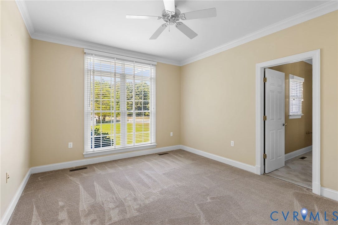 2365 Manakintown Ferry Road, Powhatan, VA 23113 Wall-to-wall carpeting, crown molding, and a ceiling fan with light fixture