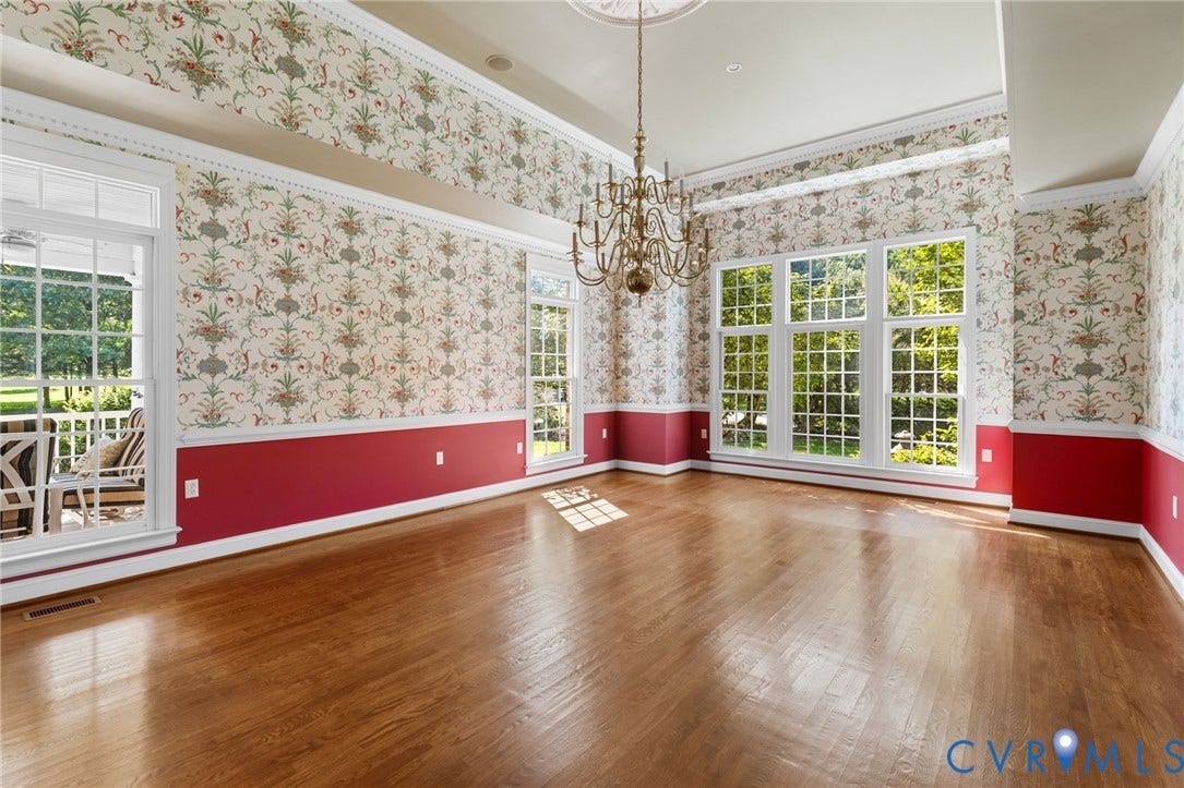 2365 Manakintown Ferry Road, Powhatan, VA 23113 Hardwood flooring, decorative wallpaper, extensive white trim, central chandelier, and large pane windows