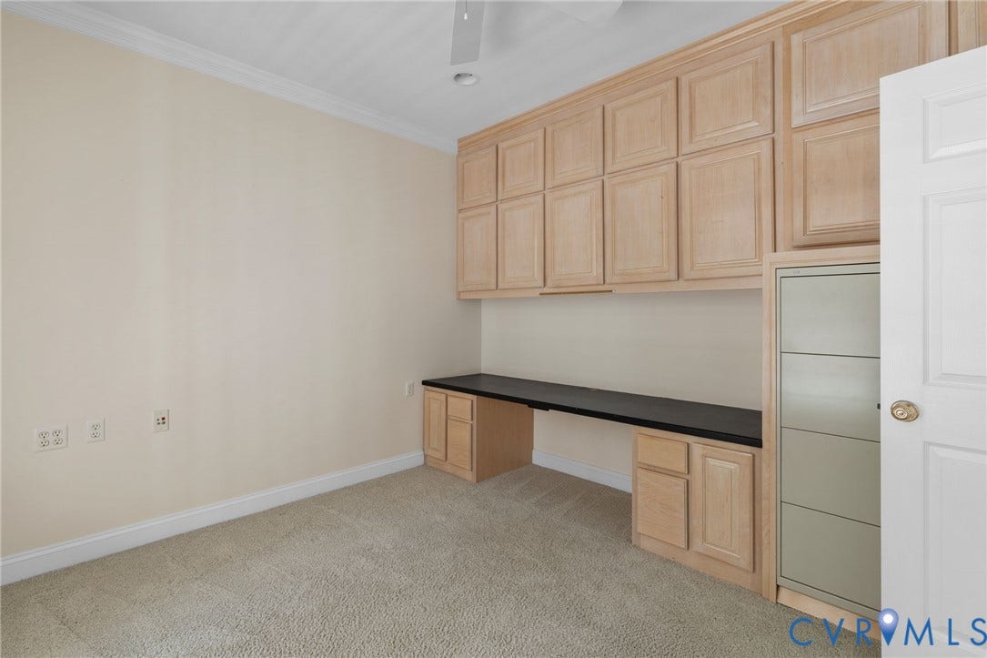 2365 Manakintown Ferry Road, Powhatan, VA 23113 Integrated built-in desk with a dark countertop and ample upper cabinetry