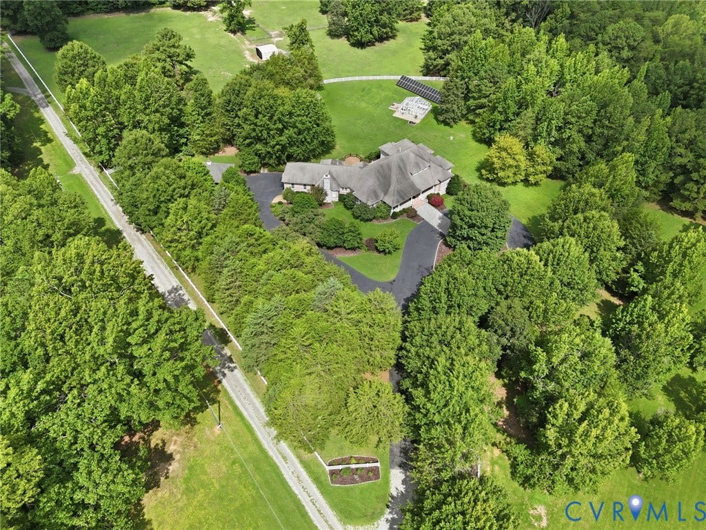 2365 Manakintown Ferry Road, Powhatan, VA 23113 Expansive property with a paved driveway, mature trees, and a substantial residential structure