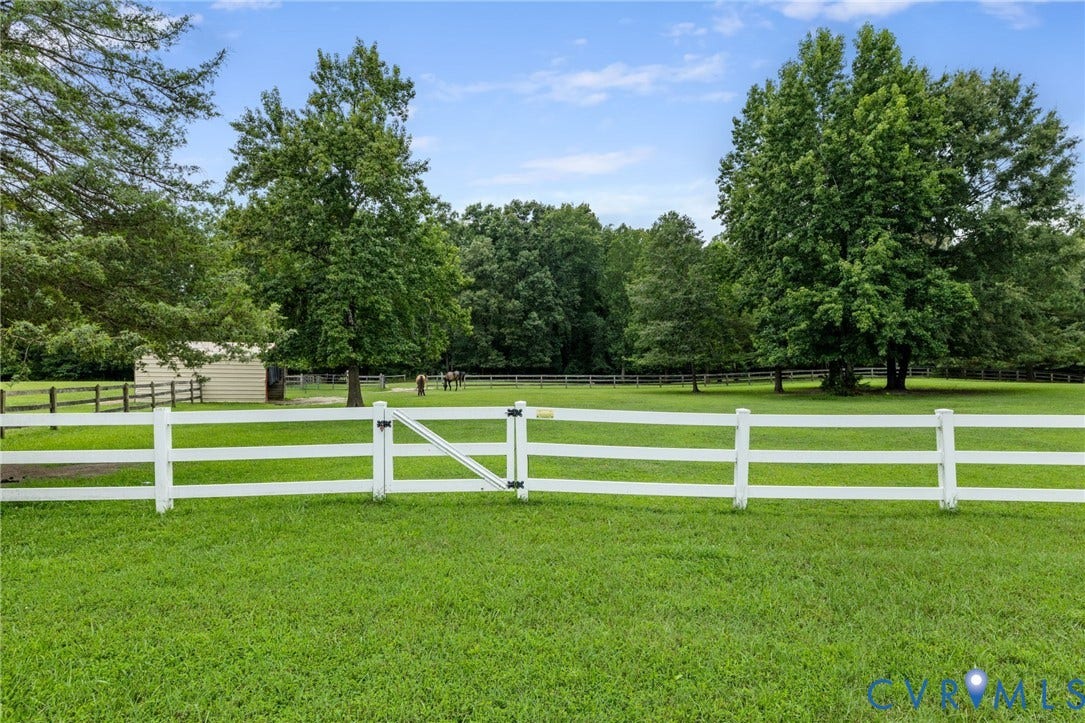 2365 Manakintown Ferry Road, Powhatan, VA 23113 Expansive grass lawn with white fencing and a gate