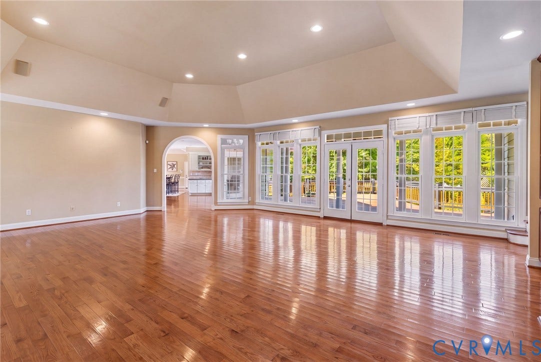2365 Manakintown Ferry Road, Powhatan, VA 23113 Hardwood flooring throughout, recessed lighting, arched doorway, and multiple French doors with transom windows