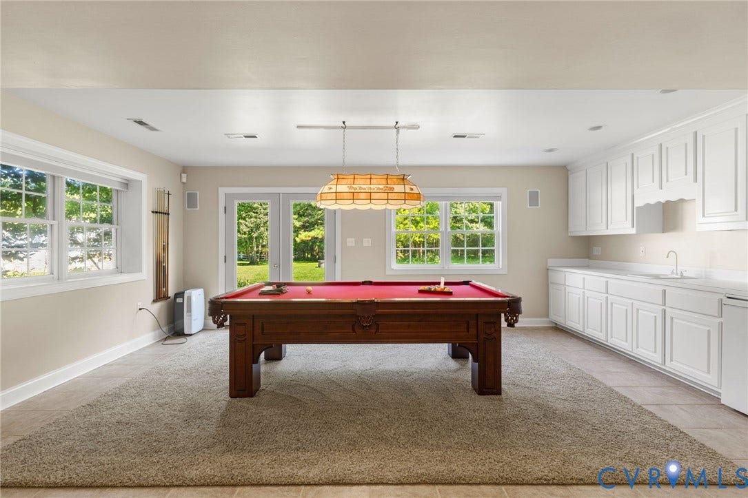 2365 Manakintown Ferry Road, Powhatan, VA 23113 Spacious recreation room featuring multiple windows, French doors, a built-in wet bar with white cabinetry, and recessed lighting