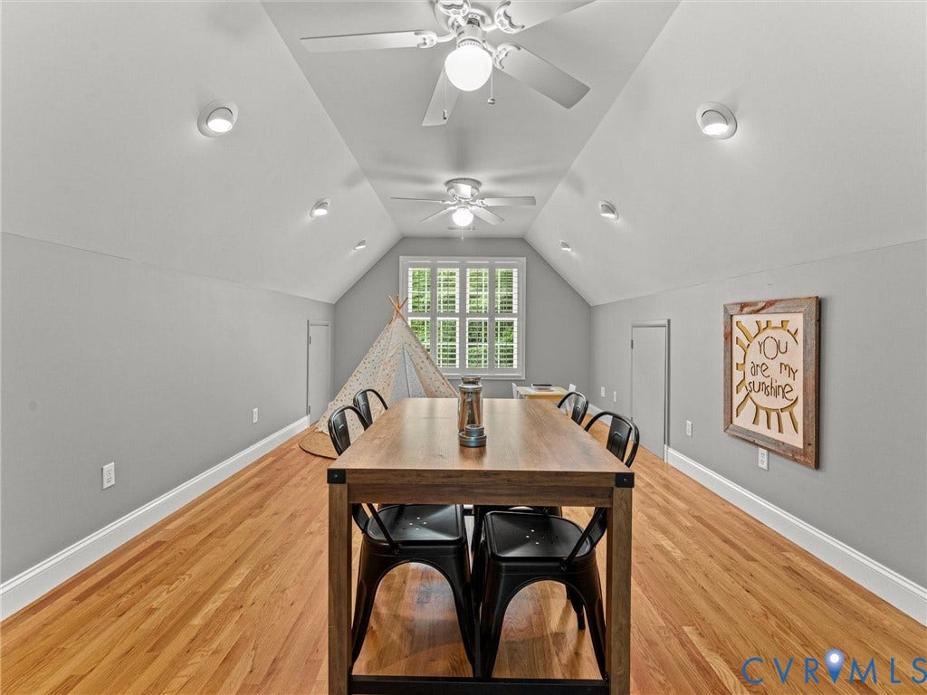 Vaulted ceiling with recessed lighting and ceiling fans