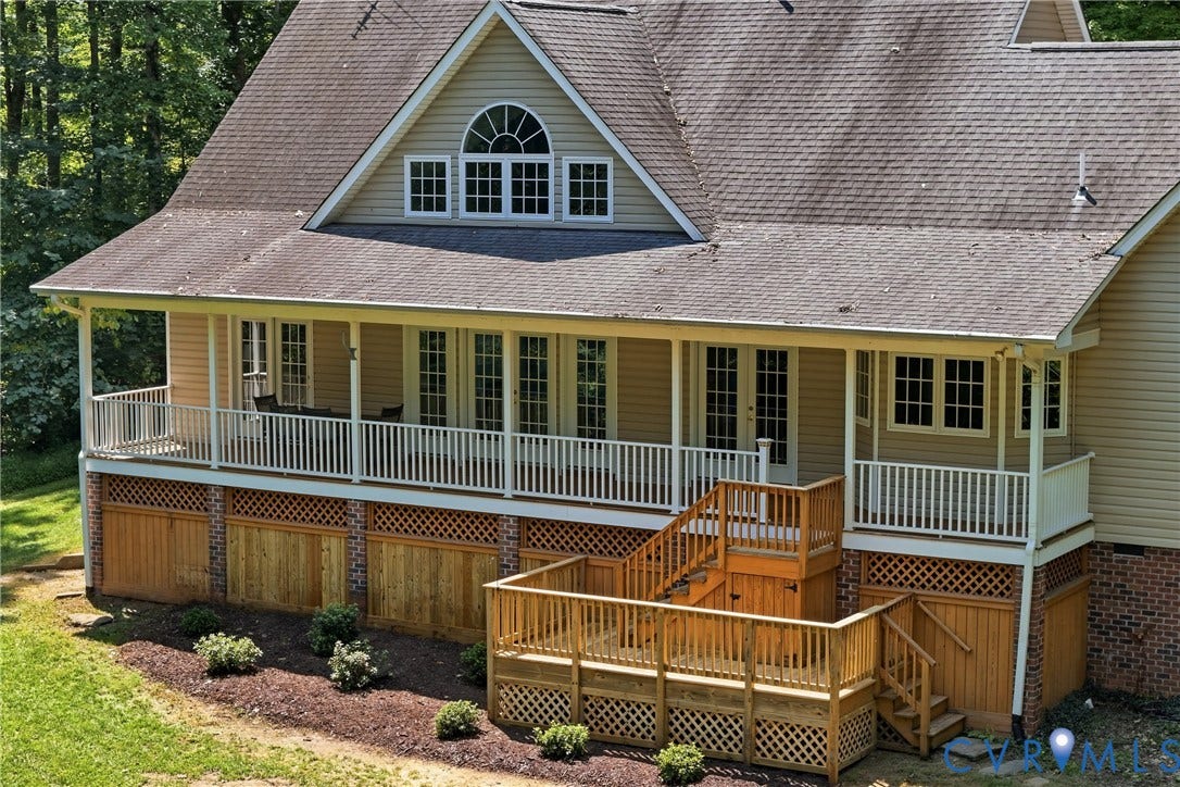 Multi-level outdoor decking featuring natural wood railing and lattice accents
