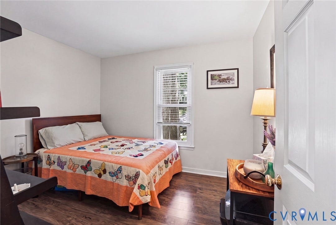 13512 Master Stag Drive, Midlothian, VA 23112 Bedroom featuring wood-finish flooring, a single-panel window, and a white six-panel door