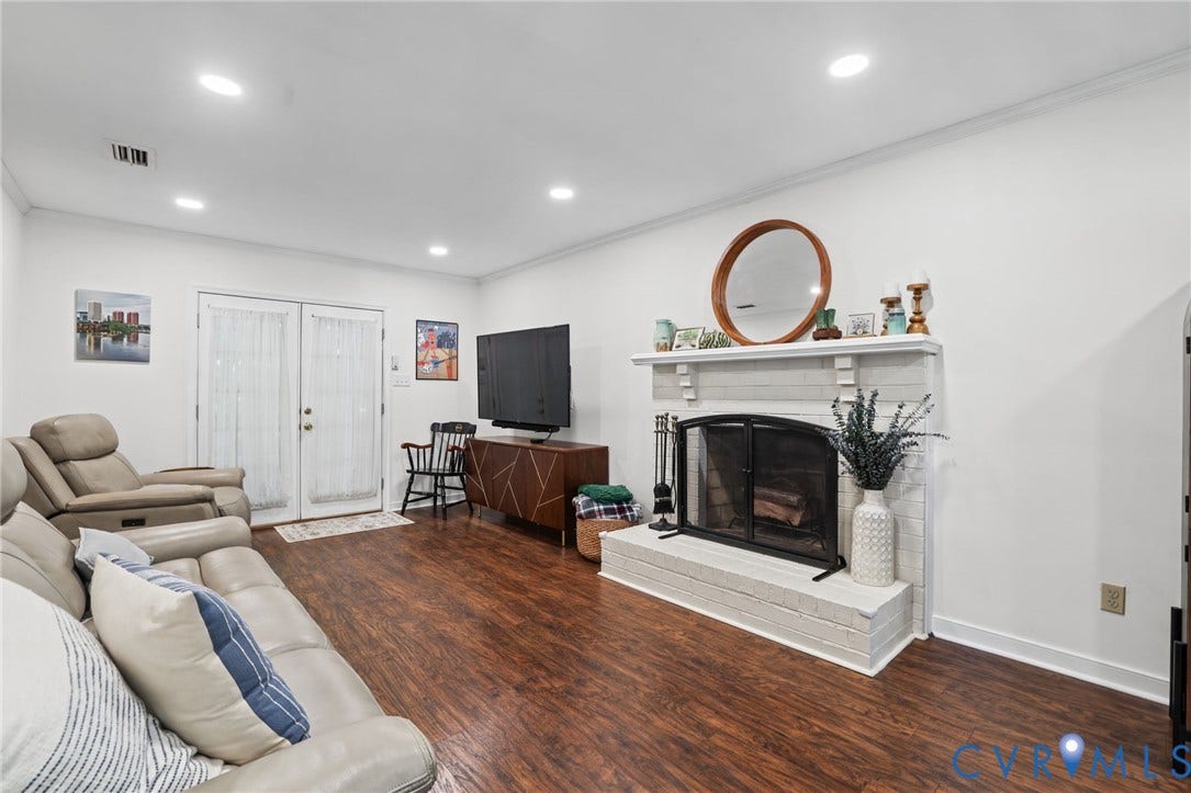 13512 Master Stag Drive, Midlothian, VA 23112 Living area featuring wood-finish flooring, recessed lighting, and a painted brick fireplace with a mantel