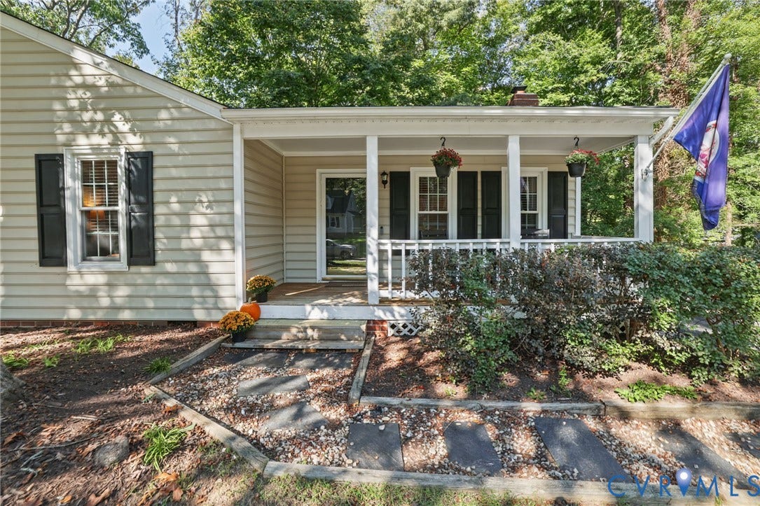 13512 Master Stag Drive, Midlothian, VA 23112 Covered front porch with white railing, light-toned horizontal siding, dark-toned shutters, and a stone-paver walkway