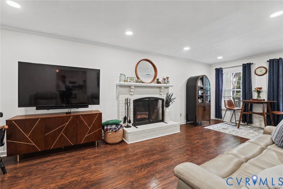 13512 Master Stag Drive, Midlothian, VA 23112 Living area featuring wood-finish flooring, a painted brick fireplace with a decorative mantel, and recessed lighting