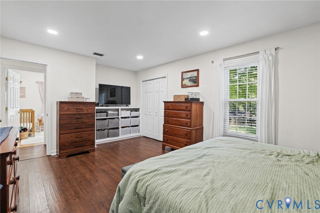 13512 Master Stag Drive, Midlothian, VA 23112 Wood-finish flooring, recessed lighting, built-in shelving, white multi-panel doors, and a double-hung window