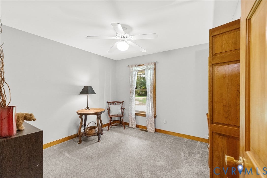 3621 Jefferson Highway, Rual, Mineral, VA 23093 Bright secondary bedroom featuring hardwood-finish flooring, ceiling fan with integrated lighting, and large windows with natural light