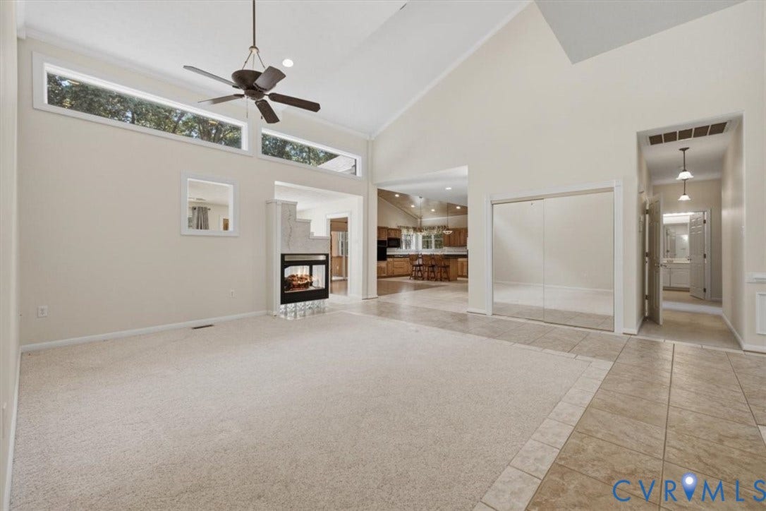 12600 Lilking Road, Chester, VA 23831 Spacious great room with soaring vaulted ceilings, ceiling fan, and abundant natural light from transom windows