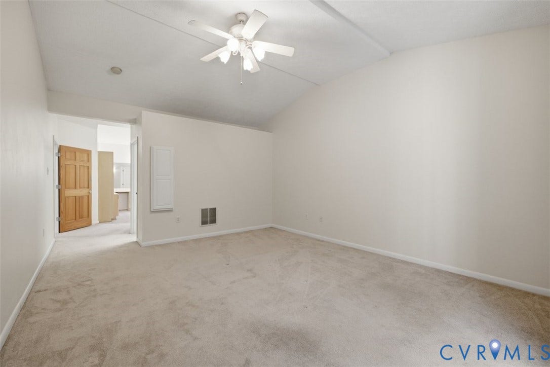 12600 Lilking Road, Chester, VA 23831 Spacious bedroom with neutral carpet flooring, ceiling fan with integrated lighting, and abundant natural light from multiple windows