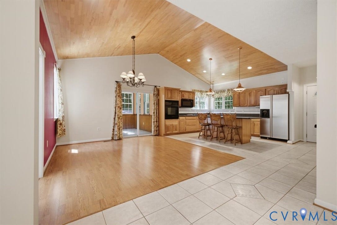 12600 Lilking Road, Chester, VA 23831 Vaulted wood-finish ceiling, wood-finish flooring, tile flooring, kitchen island with seating, and stainless steel appliances