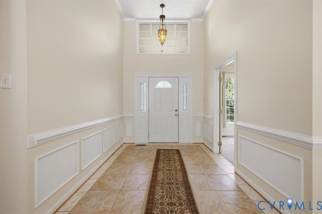 12600 Lilking Road, Chester, VA 23831 entryway with ceramic tile flooring, decorative wainscoting, and crown molding