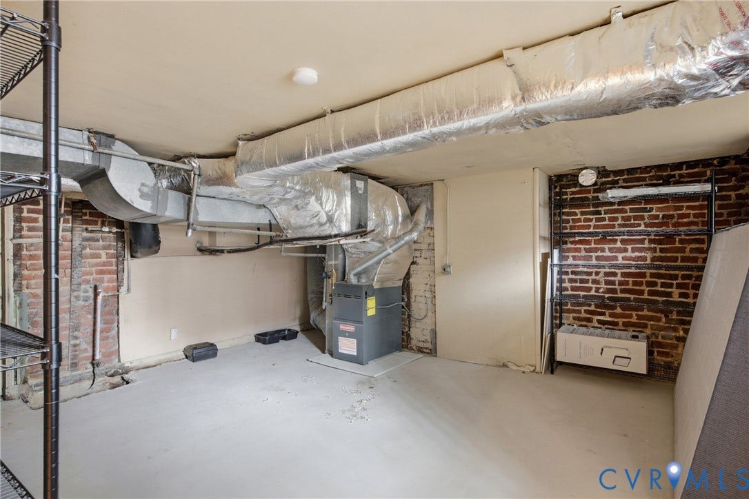 209 W Clay Street, Jackson Ward, Richmond, VA 23220 Exposed brick wall accents, utility access, and ample storage shelving