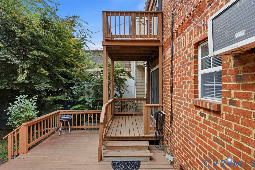 209 W Clay Street, Jackson Ward, Richmond, VA 23220 Multi-level wood deck with wood railings, outdoor living space