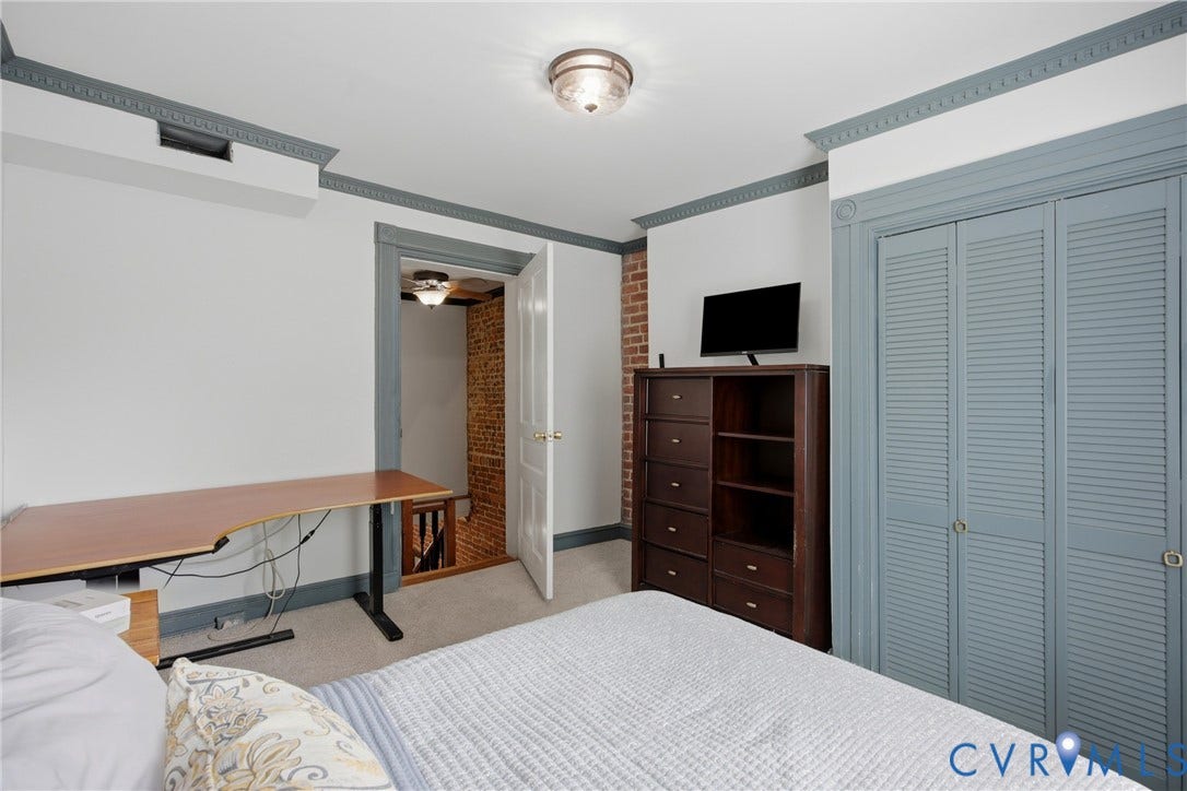 209 W Clay Street, Jackson Ward, Richmond, VA 23220 2nd bedroom, carpeted flooring, crown molding, double louvered closet doors