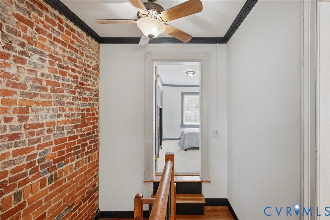 209 W Clay Street, Jackson Ward, Richmond, VA 23220 Exposed brick wall, hardwood flooring, view of 2nd bedroom